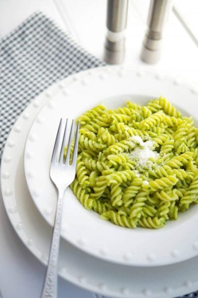 A plate of food on a table, with Pesto and Basil