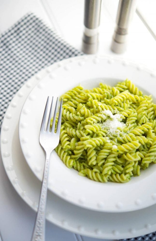 A plate of food on a table, with Pesto and Basil