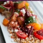 A closeup of a plate of Santorini Farro Salad. 