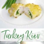 Turkey Kiev cut in half on a white plate. 