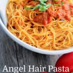 a bowl of angel hair pasta with tomato sauce