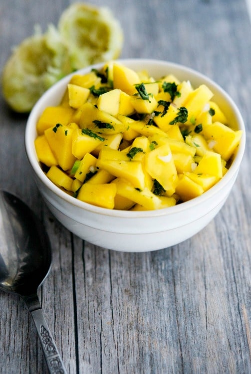This Mango Salsa is refreshingly light and takes minutes to prepare. Try it on top of your favorite grilled chicken or fish recipe too! 
