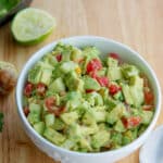 This Tomato, Cucumber & Avocado Salad made with ripe avocado, garden fresh tomatoes and cucumbers is so light and flavorful.