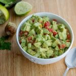 Tomato, Cucumber, Avocado Salad in a white bowl