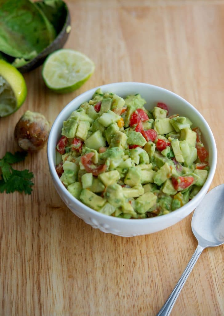 Tomato, Cucumber, Avocado Salad in a white bowl