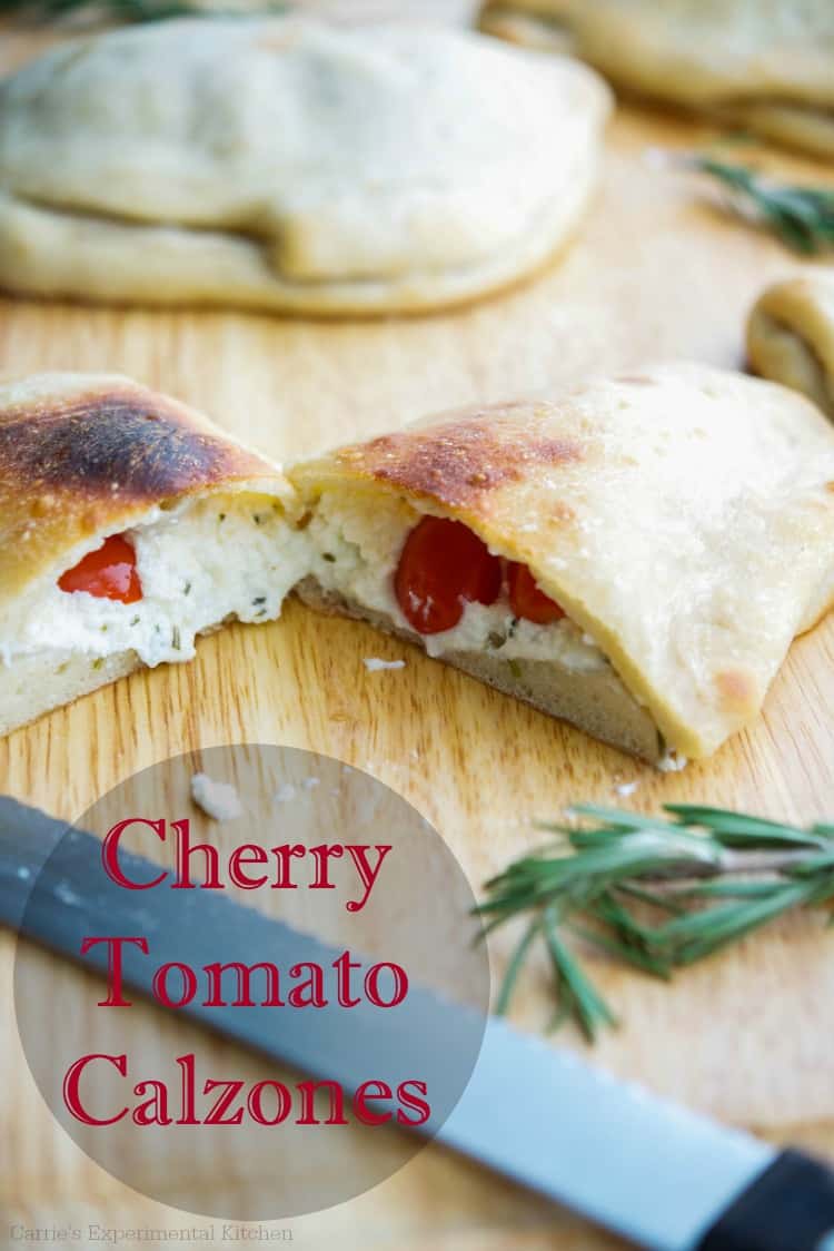 Cherry Tomato Calzones on a wooden cutting board