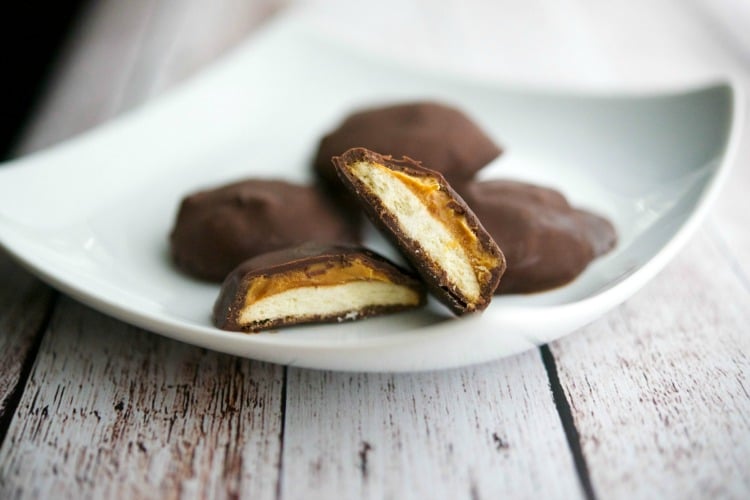 Tagalong cookies on a white plate. 