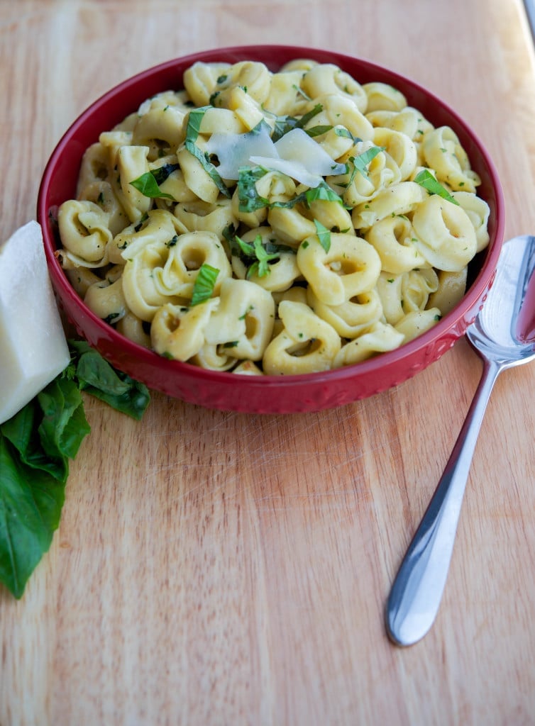 Tortellini with Brown Butter, Garlic & Basil in a red bowl