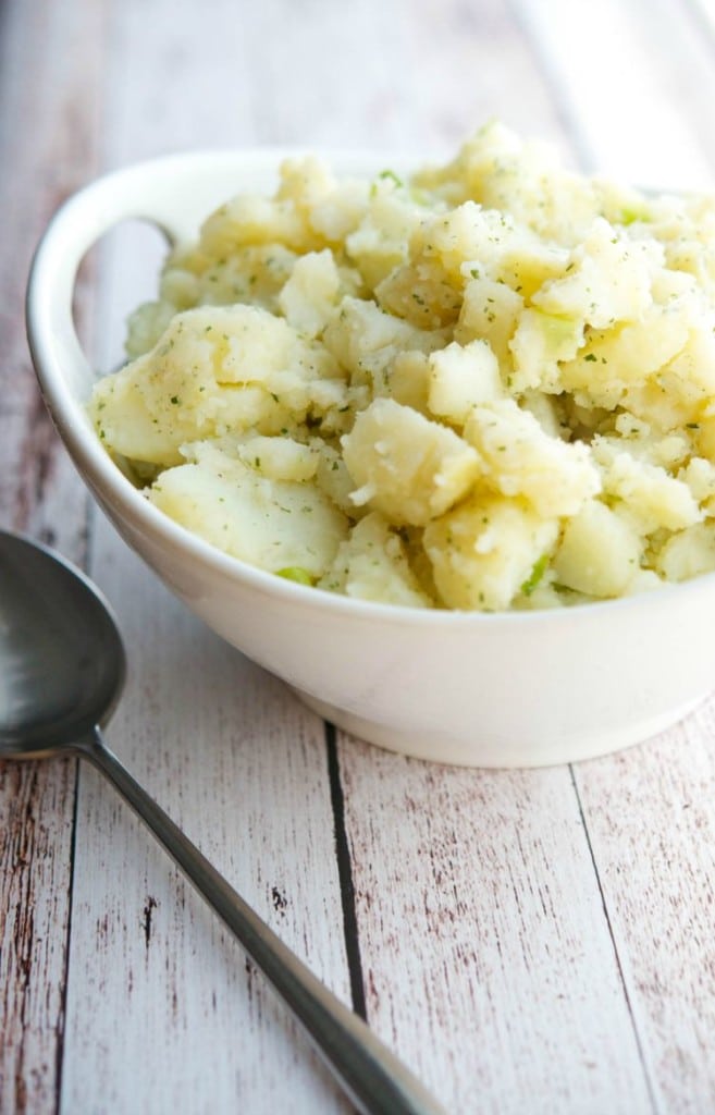 Ranch potato salad in a white serving bowl. 