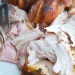 This recipe for Maple Bacon Roasted Turkey is so easy to make, you'll spend less time in the kitchen this Thanksgiving and more time with your guests.