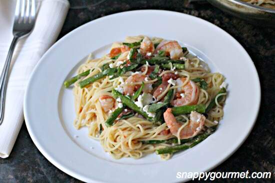 A bowl of food on a plate, with Shrimp and Seafood