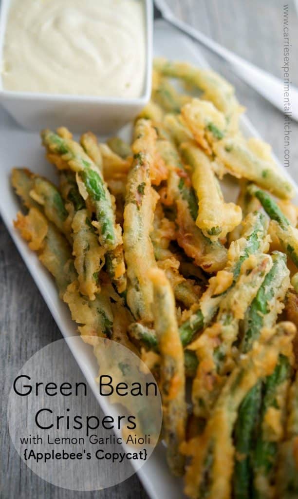 A close up of a plate of food, with Green Beans and Aioli