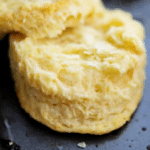 a close up of a flaky buttermilk biscuit