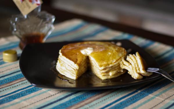 A stack of pancakes on a plate. 