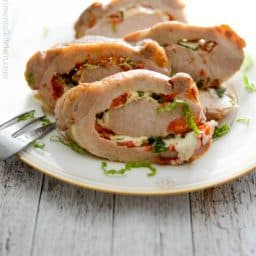 Tender center cut pork loin stuffed caprese-style with fresh tomatoes, garlic, basil and mozzarella cheese (includes video).