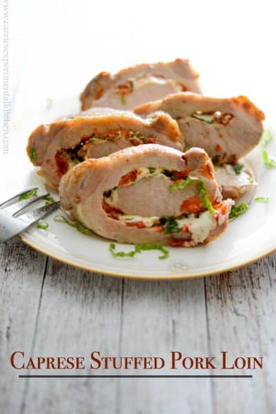 Tender center cut pork loin stuffed caprese-style with fresh tomatoes, garlic, basil and mozzarella cheese (includes video).