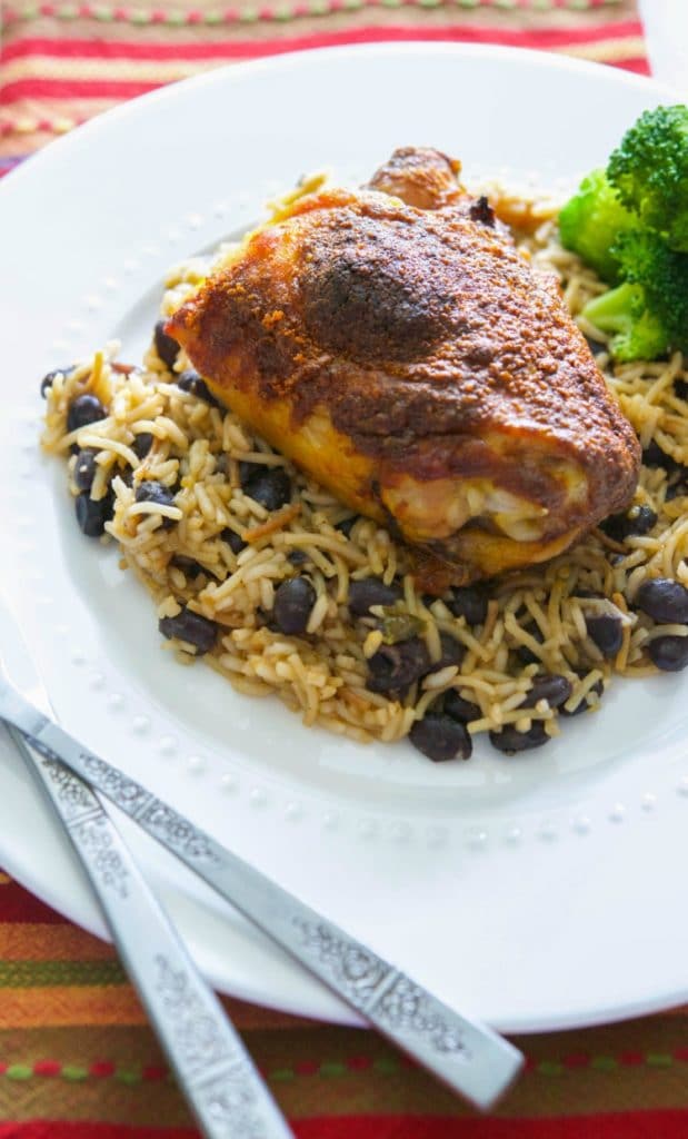 Make this Taco Baked Chicken with three simple ingredients; then serve it over Spanish rice and beans for a tasty, weeknight meal.