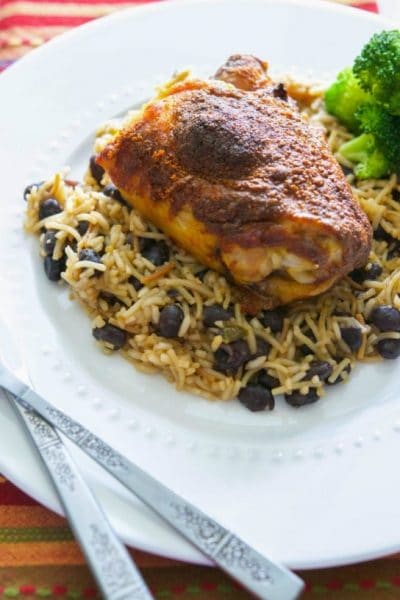 Make this Taco Baked Chicken with three simple ingredients; then serve it over Spanish rice and beans for a tasty, weeknight meal.