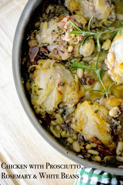 A close up of Chicken with Prosciutto, Rosemary and White Beans in a skillet.