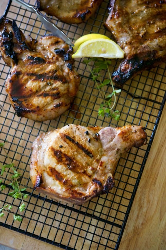 Fresh lemon zest and juice, oregano, and honey create a simple, yet flavorful marinade for these moist grilled pork chops.