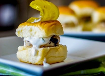 Mediterranean Turkey Sliders made with lean ground turkey, Kalamata olives, Feta cheese, and oregano on top of a sweet slider bun. 