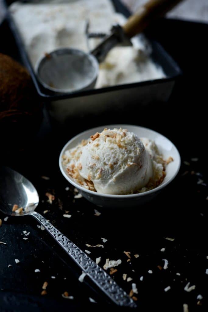 Toasted Coconut Ice Cream made with natural ingredients like coconut milk, heavy cream, sugar, coconut extract and flaky toasted coconut. 