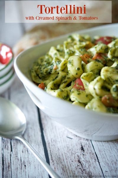 Cheese filled tortellini pasta cooked al dente; then lightly tossed in a creamy spinach and tomato sauce is a deliciously quick weeknight meal.