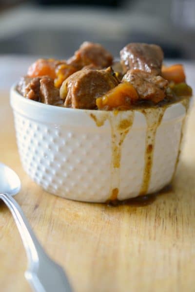 A close up of Hungarian Pork Stew in a white bowl.