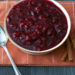Spiced Cider Cranberry Sauce made with fresh whole cranberries slowly simmered in apple cider, sugar and pumpkin pie spice will make a tasty addition to your Thanksgiving table.