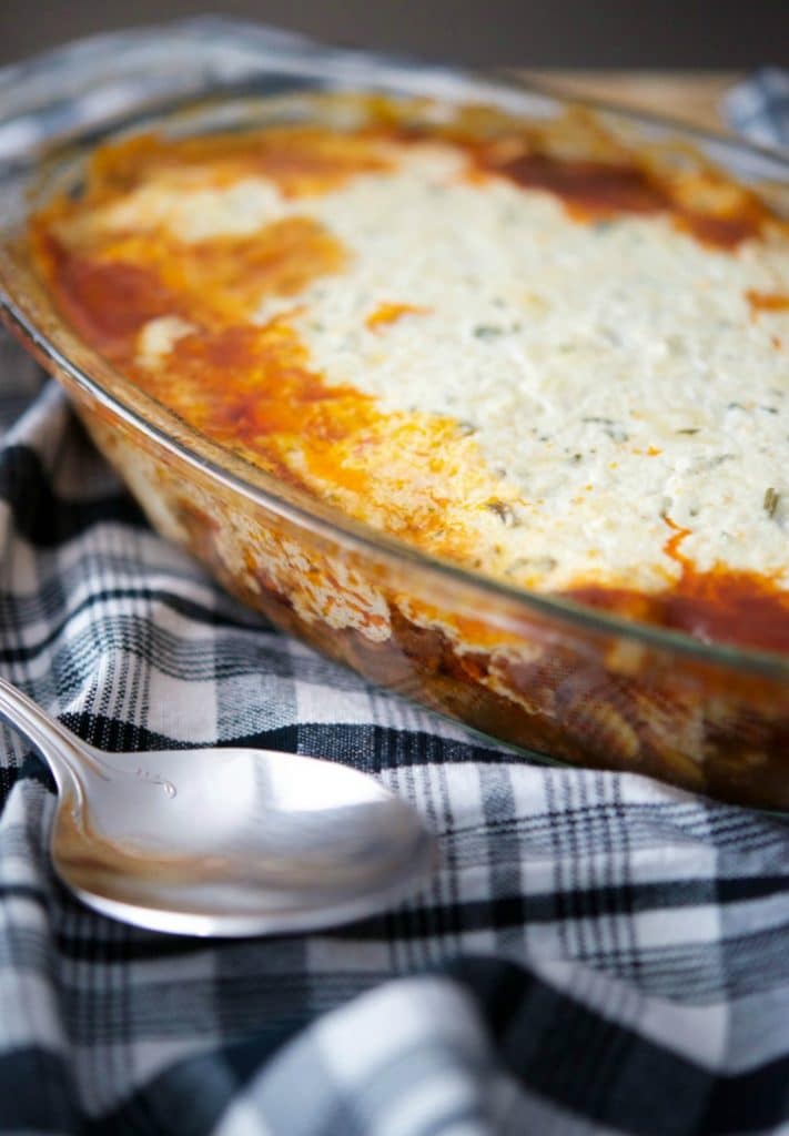 Beef Ricotta Casserole in a baking dish with serving spoon. 