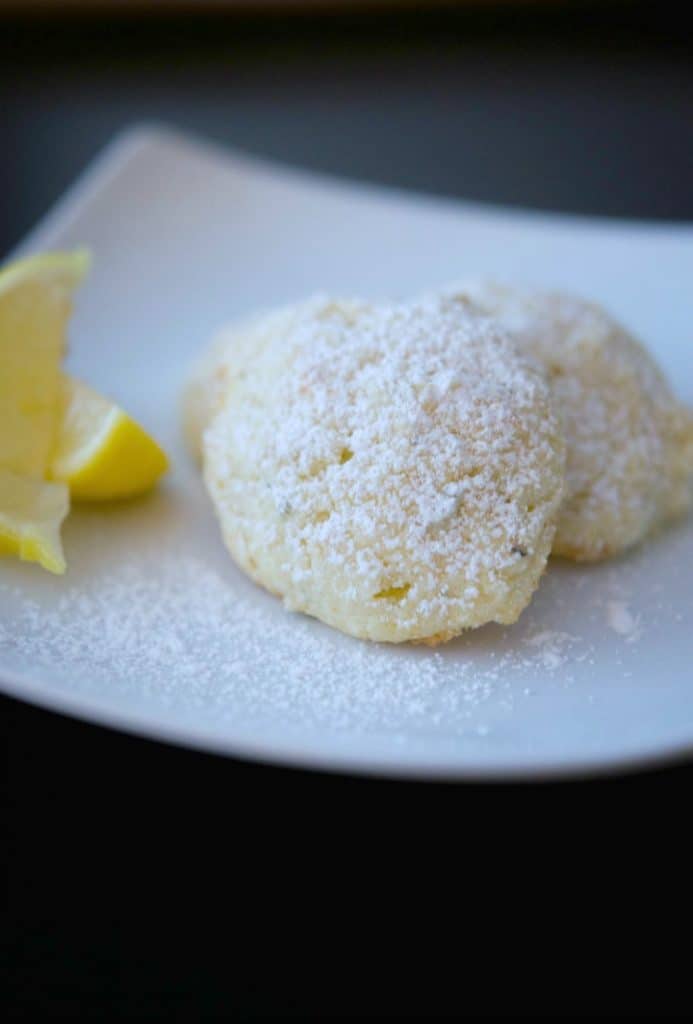 A piece of cake on a plate, with Lemon and Cookie