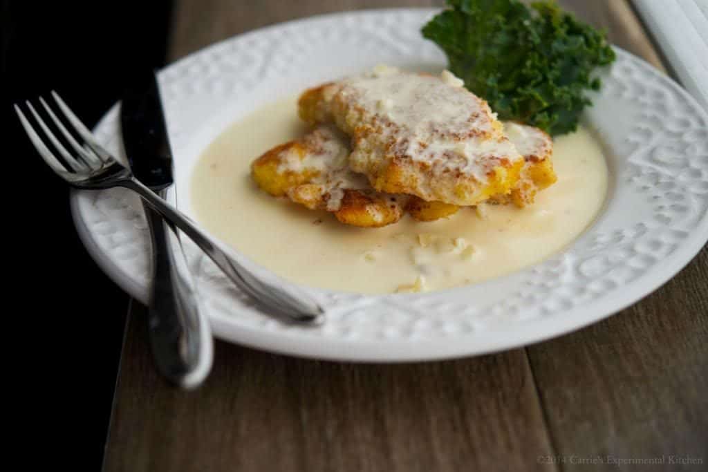 Chicken Costoletta on a white dish. 