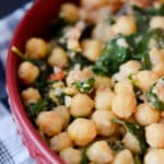 Sautéed chick peas tossed with garlic, tomatoes, spinach, lemon and vegetable broth make a satisfying vegetarian side dish or hearty lunch.