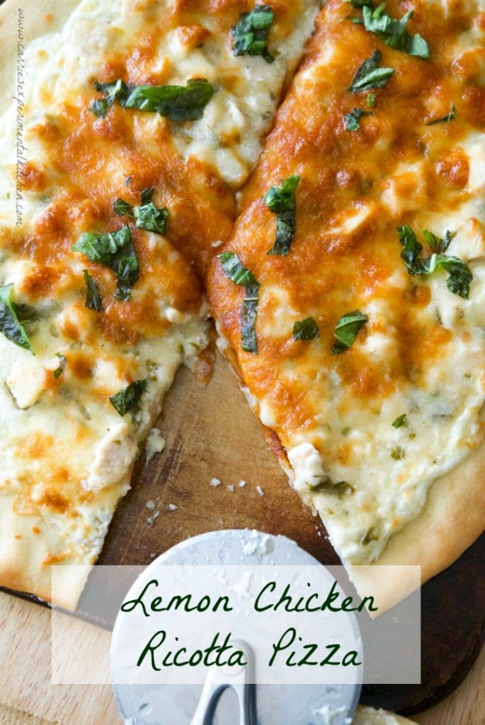 Lemon Chicken Ricotta Pizza on a wooden cutting board. 