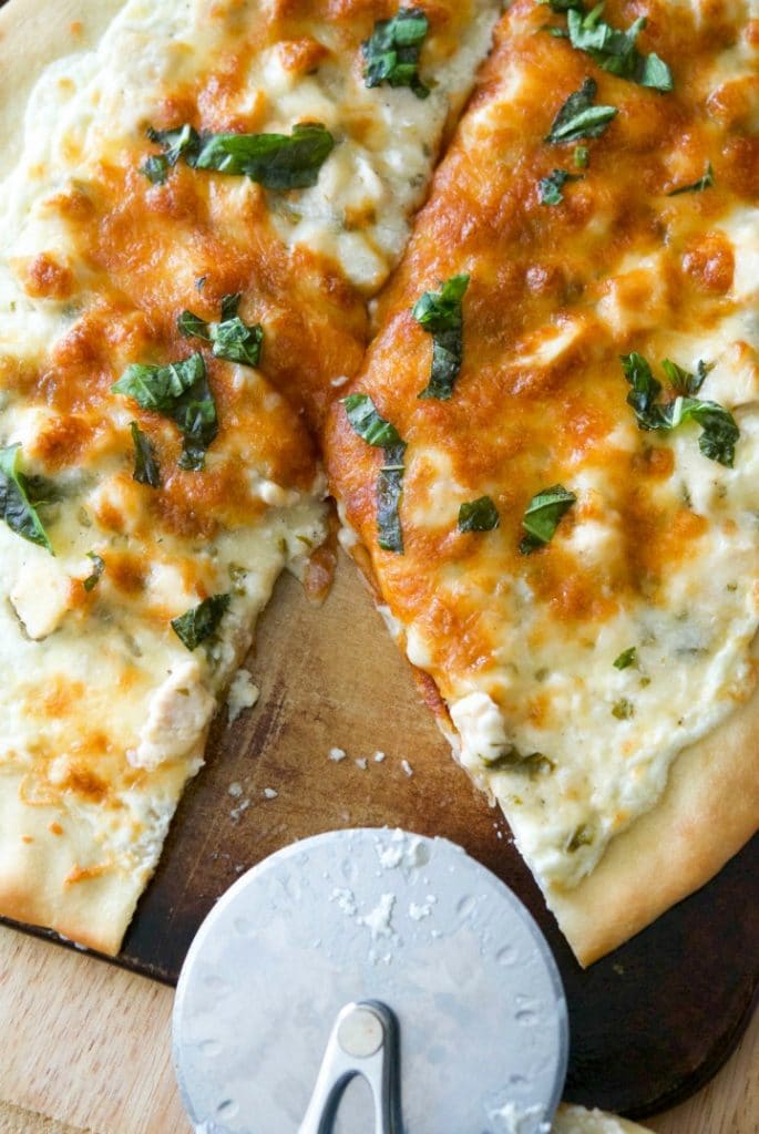 Lemon Chicken Ricotta Pizza is a white pizza made with a mixture of ricotta and mozzarella cheeses; then topped with boneless chicken in a lemon basil sauce.