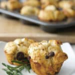 Savory Mediterranean Monkey Bread Rolls made with refrigerated biscuits, rosemary, sun dried tomatoes, olives and cheese.