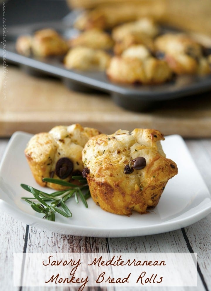 These Savory Mediterranean Monkey Bread Rolls made with flaky biscuits, fresh rosemary, sun dried tomatoes, Kalamata olives and a variety of cheeses are the perfect accompaniment to any meal. 