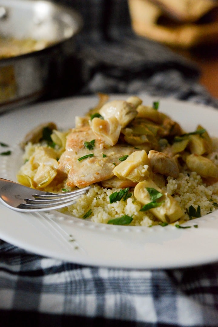 A close up of plate of food, with Chicken and Artichoke