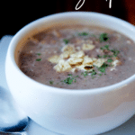 black bean soup in a white crock