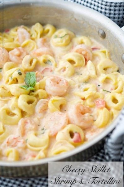 Cheesy Skillet Shrimp & Tortellini made with jumbo shrimp combined with cheese tortellini in a cheesy tomato basil Alfredo sauce.