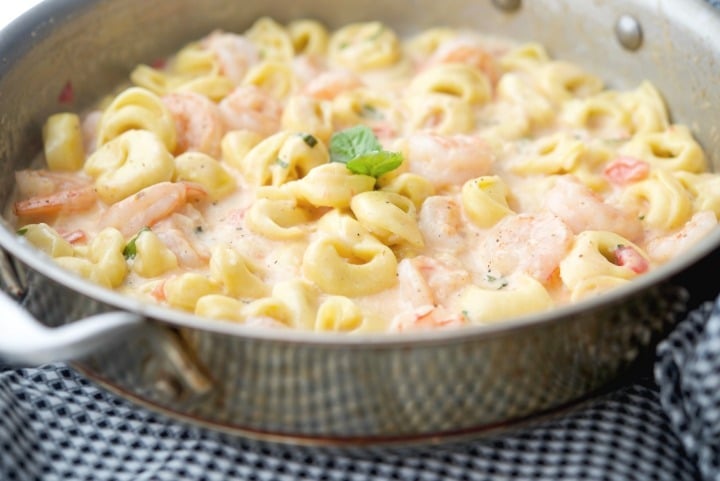 A bowl filled with pasta, with Shrimp and Tortellini