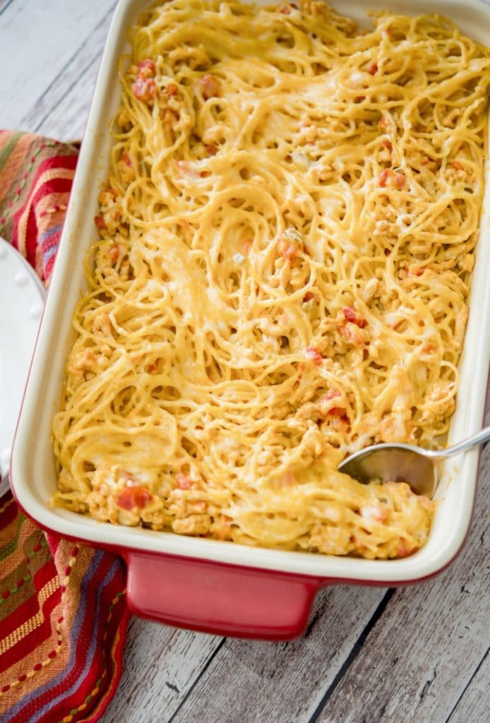 Spaghetti Casserole in a red casserole dish. 