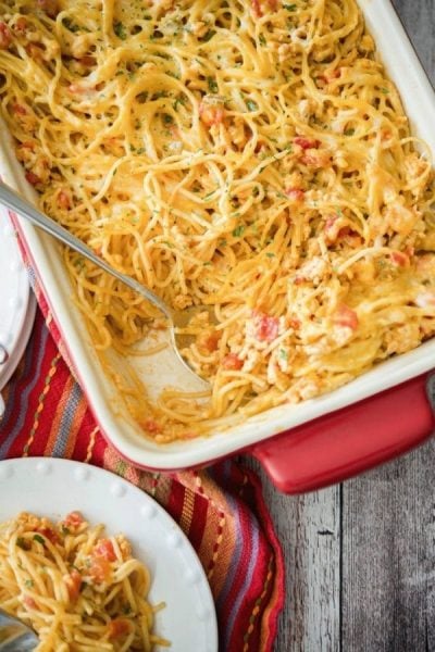 Low Fat Taco Spaghetti Casserole with a spoon in a casserole dish.