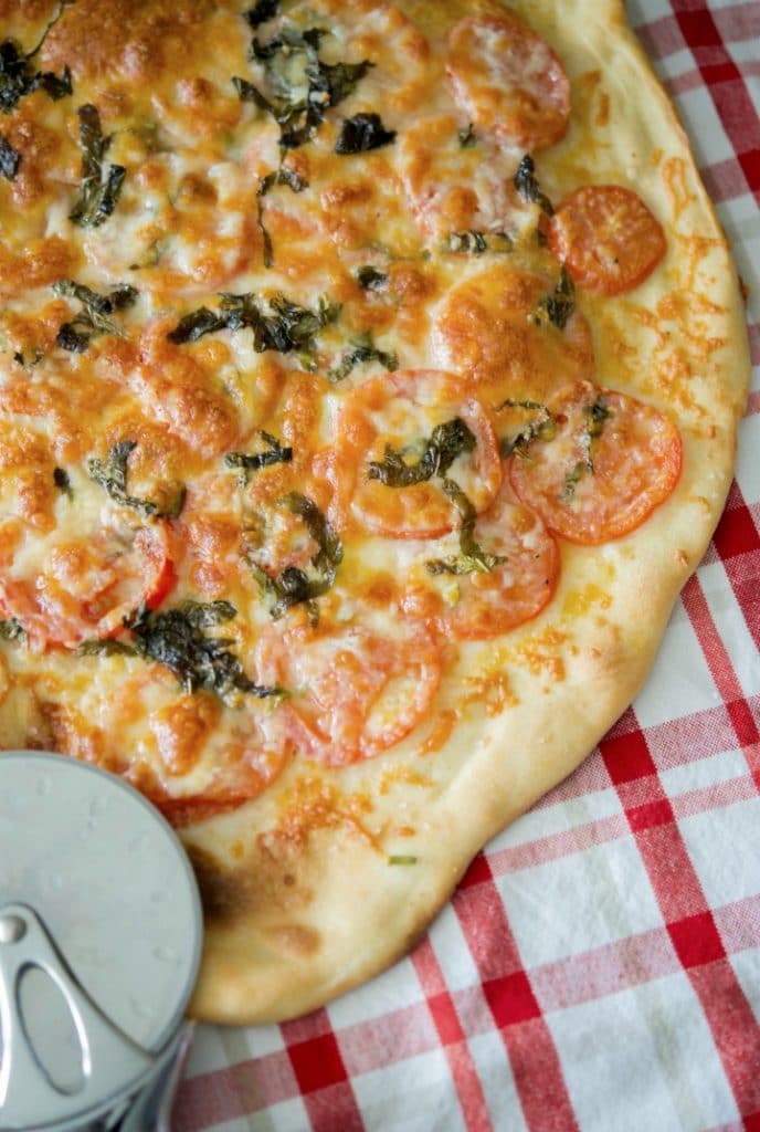 Pizza Margherita reflects the colors of Italy, red, green and white; and is mostly made with fresh tomatoes, basil & mozzarella cheese. 