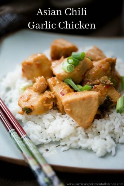 Asian Chili Garlic Chicken over rice on a plate.