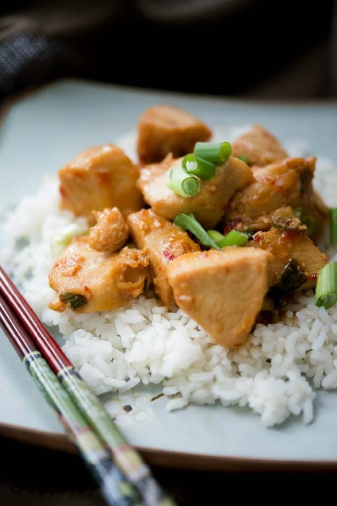 A plate of food Asian Chili Garlic Chicken over rice.