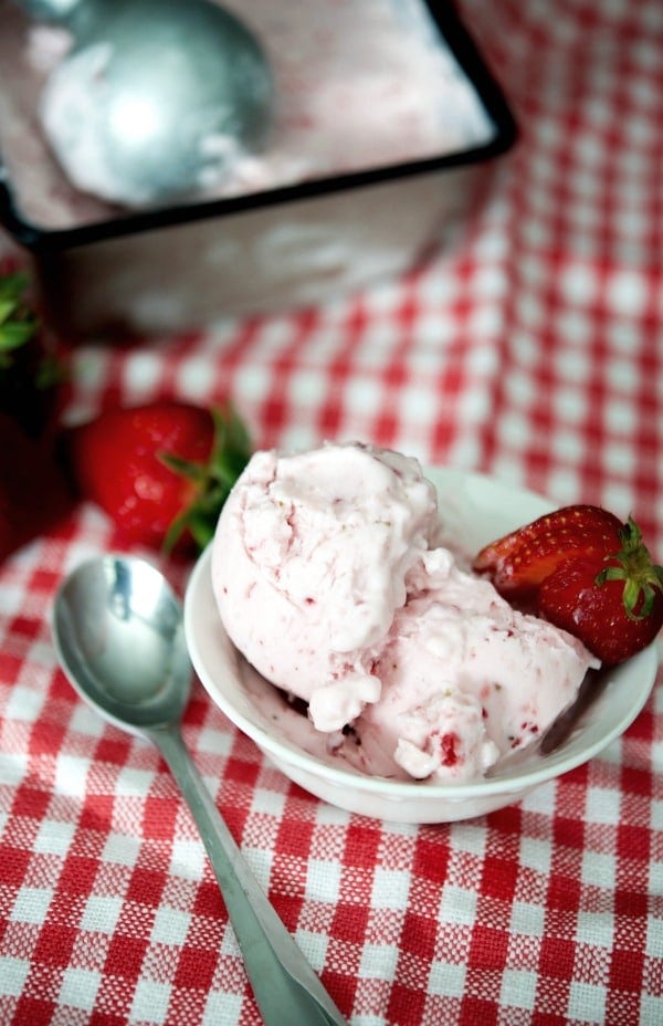 Make your own rich and creamy frozen yogurt with four simple ingredients at home including fresh strawberries and reduced fat plain Greek yogurt.