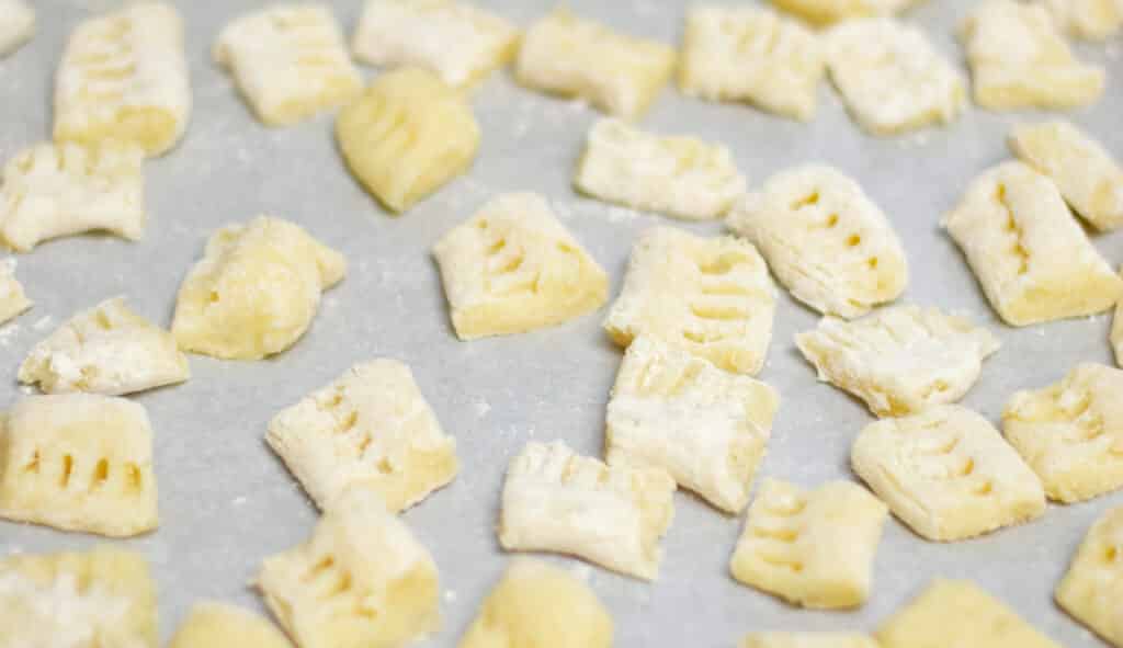 Pieces of gnocchi on a tray