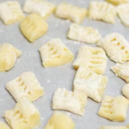 Pieces of gnocchi on a tray