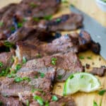 Cajun Lime Grilled Rib Eye Steak on a cutting board